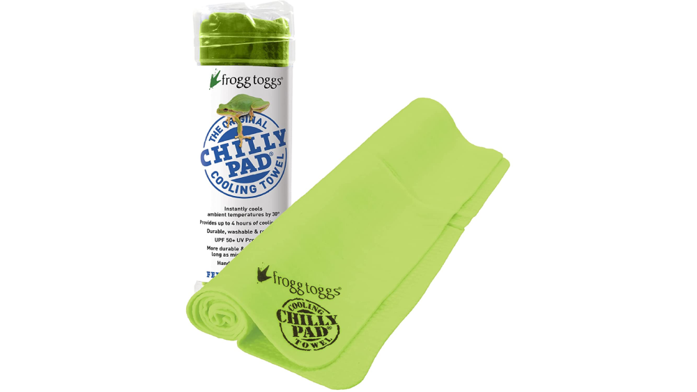 A green cooling towel is rolled up in front of its plastic storage tube.