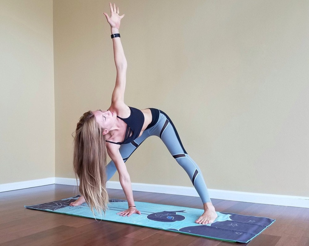 Woman stretching on a mat.