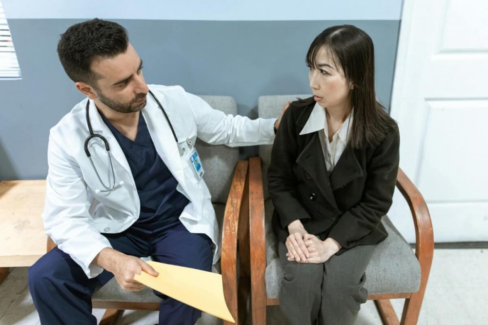 Doctor comforting a Patient